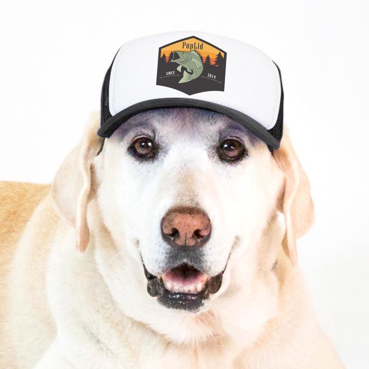 PupLid trucker hat for dogs in black jumping bass design modeled by a big yellow Labrador